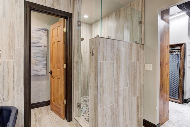 4225 Red Bud Pl, Edmond, OK 73013 - bathroom featuring tiled shower and baseboards