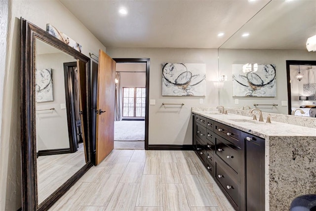 4225 Red Bud Pl, Edmond, OK 73013 - bathroom with double vanity and recessed lighting
