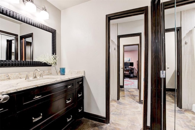 4225 Red Bud Pl, Edmond, OK 73013 - bathroom featuring vanity and marble finish floors