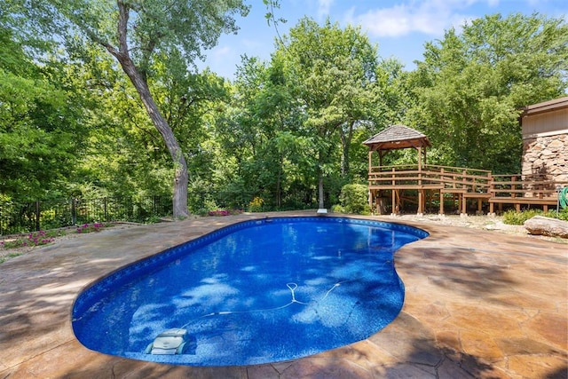 4225 Red Bud Pl, Edmond, OK 73013 - view of pool featuring a gazebo, a wooden deck, and a patio