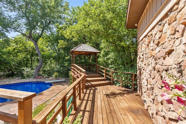 4225 Red Bud Pl, Edmond, OK 73013 - wooden terrace with a gazebo and view of wooded area