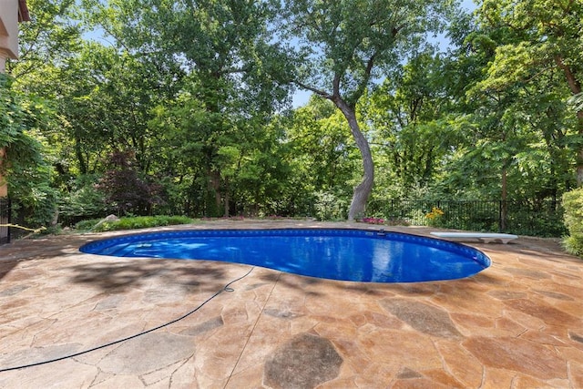 4225 Red Bud Pl, Edmond, OK 73013 - swimming pool featuring a patio area and a diving board