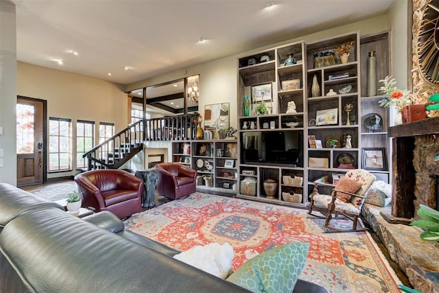 4225 Red Bud Pl, Edmond, OK 73013 - living room with stairs, recessed lighting, and a baseboard radiator