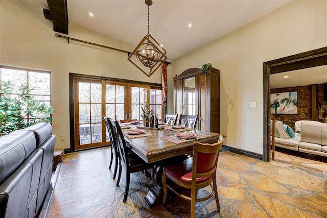 4225 Red Bud Pl, Edmond, OK 73013 - dining area featuring stone finish floors, high vaulted ceiling, a chandelier, and recessed lighting