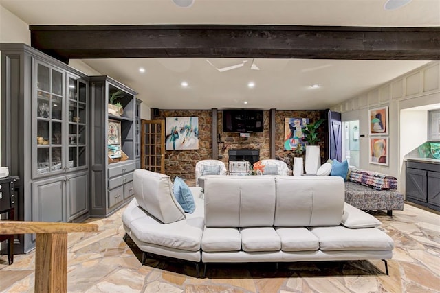 4225 Red Bud Pl, Edmond, OK 73013 - living room with beamed ceiling, recessed lighting, and light stone finish floors