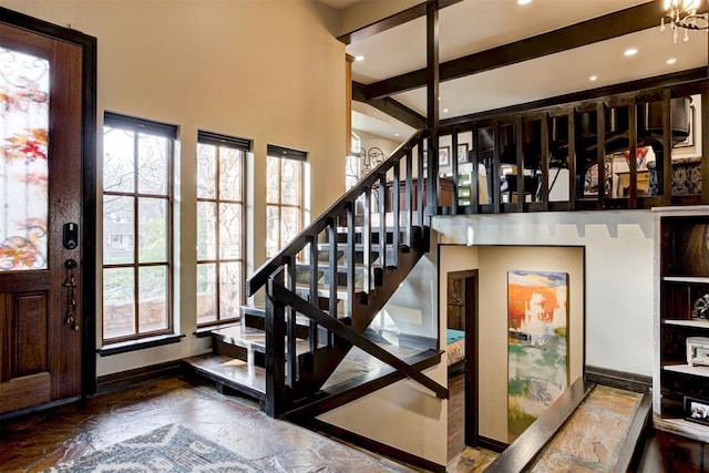 4225 Red Bud Pl, Edmond, OK 73013 - stairway featuring recessed lighting, a towering ceiling, and beam ceiling