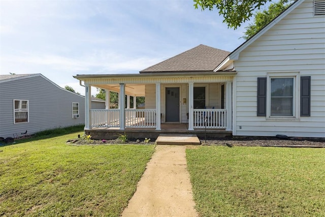 1623 W Washington Ave, Guthrie, OK 73044 - view of front of property featuring a porch, a front yard, and roof with shingles