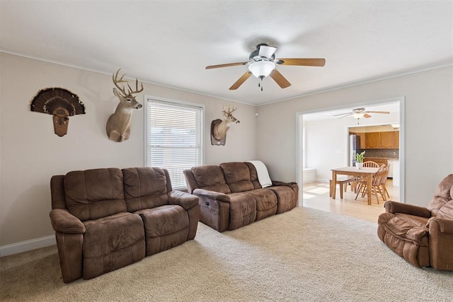 1623 W Washington Ave, Guthrie, OK 73044 - carpeted living room with ceiling fan and ornamental molding