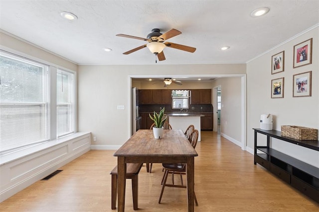1623 W Washington Ave, Guthrie, OK 73044 - dining area featuring crown molding, light wood finished floors, recessed lighting, and ceiling fan