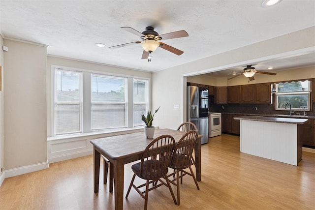 1623 W Washington Ave, Guthrie, OK 73044 - dining space with ceiling fan, light wood-style flooring, healthy amount of natural light, recessed lighting, and ornamental molding