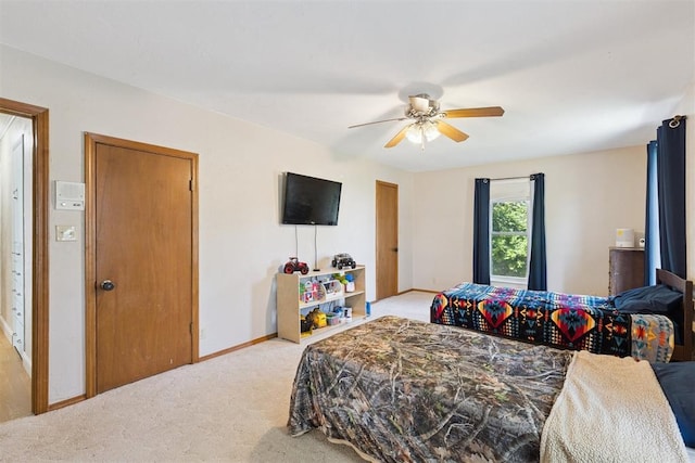 1623 W Washington Ave, Guthrie, OK 73044 - bedroom with light carpet and ceiling fan