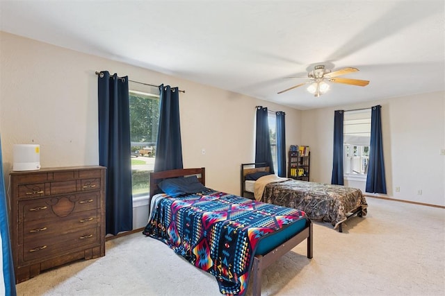 1623 W Washington Ave, Guthrie, OK 73044 - bedroom featuring light colored carpet and a ceiling fan