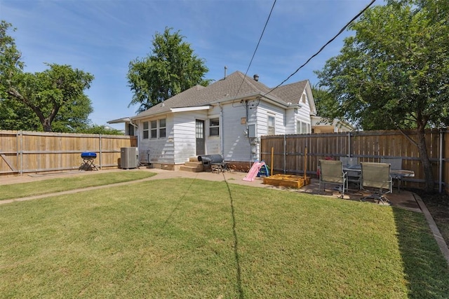 1623 W Washington Ave, Guthrie, OK 73044 - rear view of house with a fenced backyard and a patio