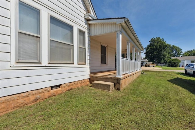 1623 W Washington Ave, Guthrie, OK 73044 - view of property exterior with covered porch and a lawn