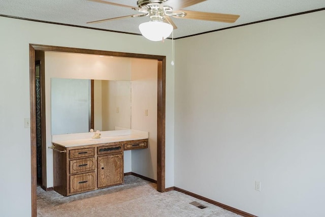 503 N Sheb Wooley Ave, Erick, OK 73645 - bathroom featuring ceiling fan, vanity, and crown molding