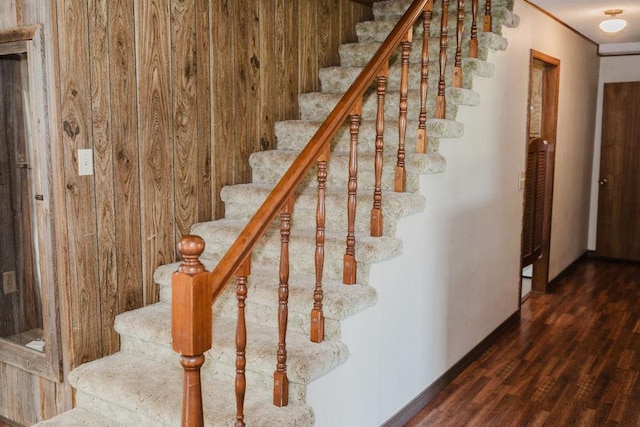 503 N Sheb Wooley Ave, Erick, OK 73645 - stairway featuring wood finished floors and wooden walls