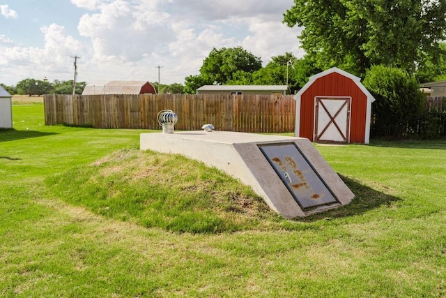 503 N Sheb Wooley Ave, Erick, OK 73645 - entry to storm shelter with a shed and a fenced backyard