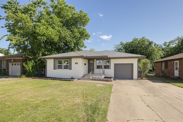 2020 Hasley Dr, The Village, OK 73120 - view of front of home with an attached garage, concrete driveway, a front lawn, and brick siding