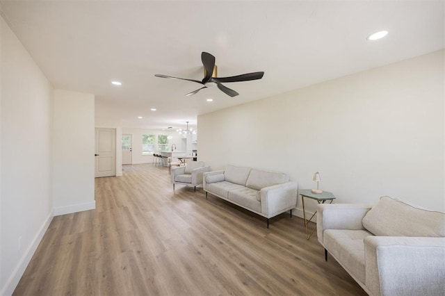 2020 Hasley Dr, The Village, OK 73120 - living area featuring recessed lighting, ceiling fan, light wood finished floors, and a chandelier