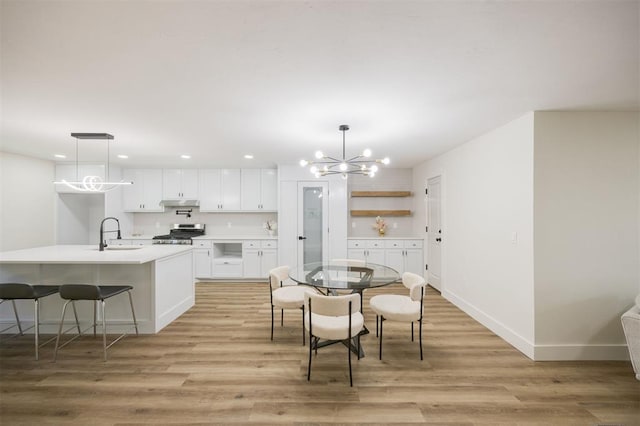 2020 Hasley Dr, The Village, OK 73120 - dining room featuring a chandelier, light wood finished floors, and recessed lighting