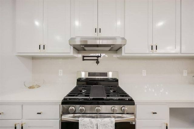 2020 Hasley Dr, The Village, OK 73120 - kitchen featuring stainless steel range with gas cooktop, under cabinet range hood, light countertops, and white cabinets