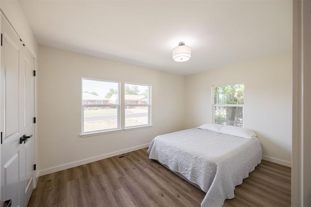 2020 Hasley Dr, The Village, OK 73120 - bedroom featuring a closet and wood finished floors