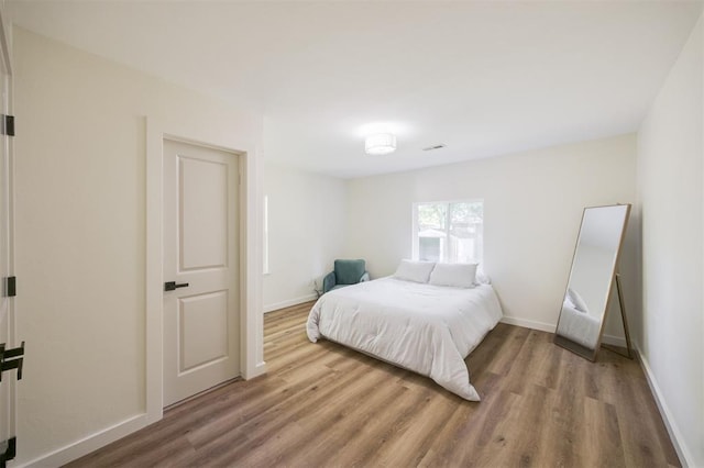 2020 Hasley Dr, The Village, OK 73120 - bedroom featuring wood finished floors and baseboards