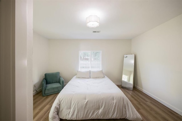 2020 Hasley Dr, The Village, OK 73120 - bedroom featuring wood finished floors and baseboards