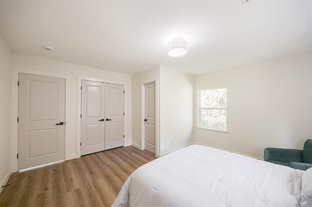 2020 Hasley Dr, The Village, OK 73120 - bedroom featuring wood finished floors and a closet