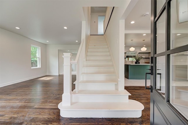2836 NW 43rd St, Oklahoma City, OK 73112 - staircase featuring wood finished floors and recessed lighting
