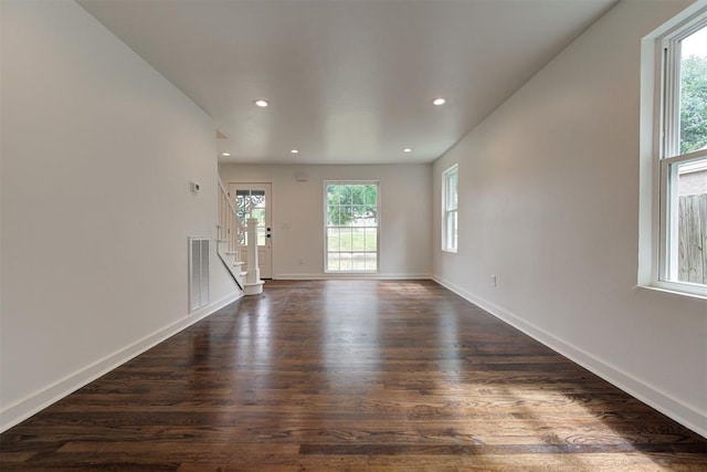 2836 NW 43rd St, Oklahoma City, OK 73112 - unfurnished room featuring dark wood-style flooring, stairs, and recessed lighting