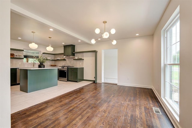 2836 NW 43rd St, Oklahoma City, OK 73112 - kitchen with green cabinetry, stainless steel stove, open shelves, plenty of natural light, and recessed lighting