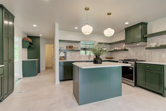 2836 NW 43rd St, Oklahoma City, OK 73112 - kitchen featuring open shelves, green cabinets, stainless steel range with gas cooktop, and recessed lighting