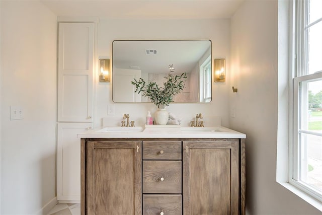 2836 NW 43rd St, Oklahoma City, OK 73112 - full bathroom with double vanity and baseboards