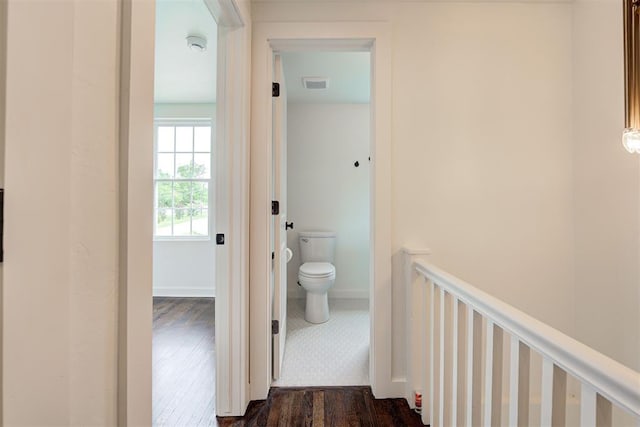 2836 NW 43rd St, Oklahoma City, OK 73112 - hallway with an upstairs landing and dark wood-type flooring
