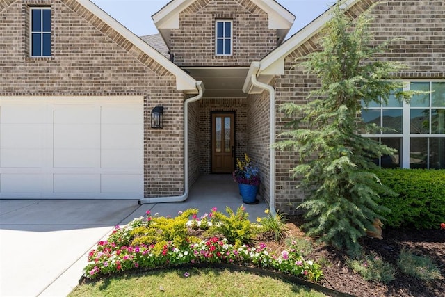 200 Pont Neuf Ct, Edmond, OK 73034 - doorway to property featuring brick siding and a garage