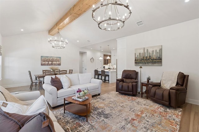 200 Pont Neuf Ct, Edmond, OK 73034 - living room featuring a chandelier and light wood-style flooring