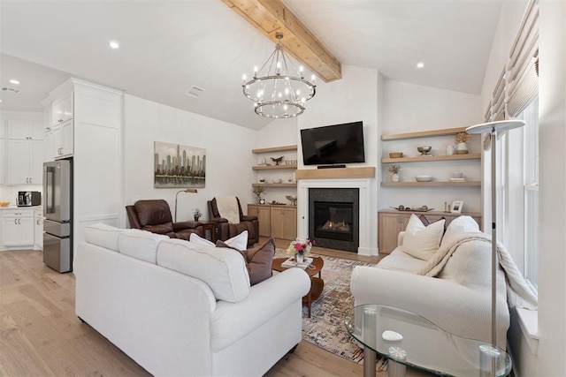 200 Pont Neuf Ct, Edmond, OK 73034 - living area with light wood-type flooring, a glass covered fireplace, a chandelier, and recessed lighting