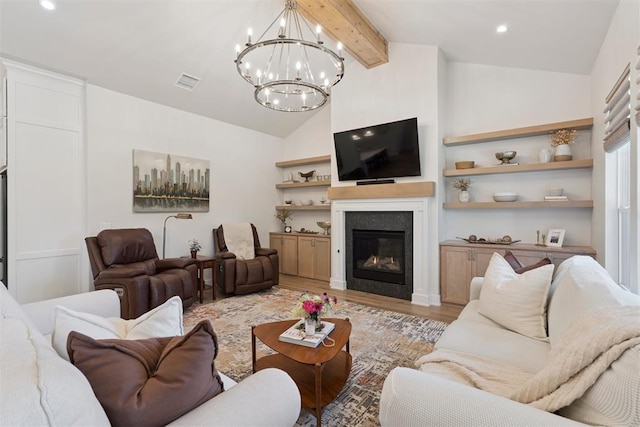200 Pont Neuf Ct, Edmond, OK 73034 - living room with a chandelier, light wood finished floors, a glass covered fireplace, and recessed lighting