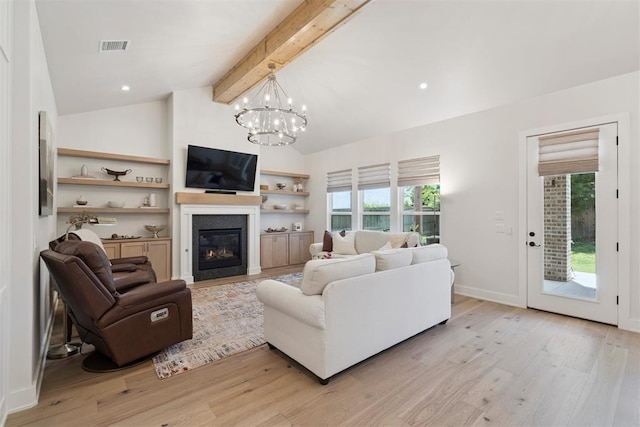 200 Pont Neuf Ct, Edmond, OK 73034 - living room with light wood finished floors, healthy amount of natural light, and a chandelier