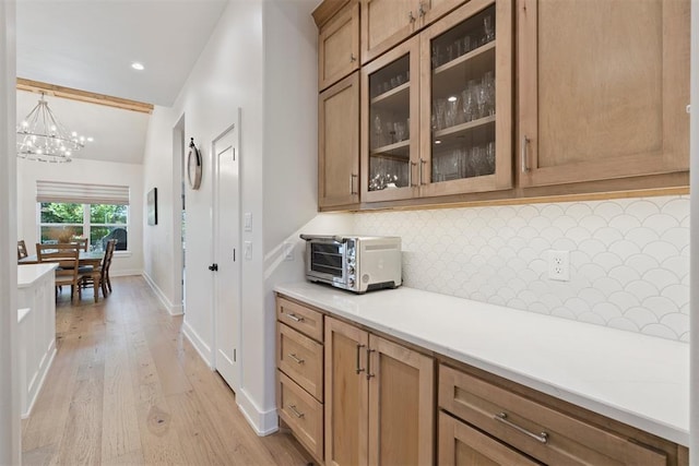 200 Pont Neuf Ct, Edmond, OK 73034 - bar featuring decorative backsplash, light wood-style floors, a chandelier, and recessed lighting