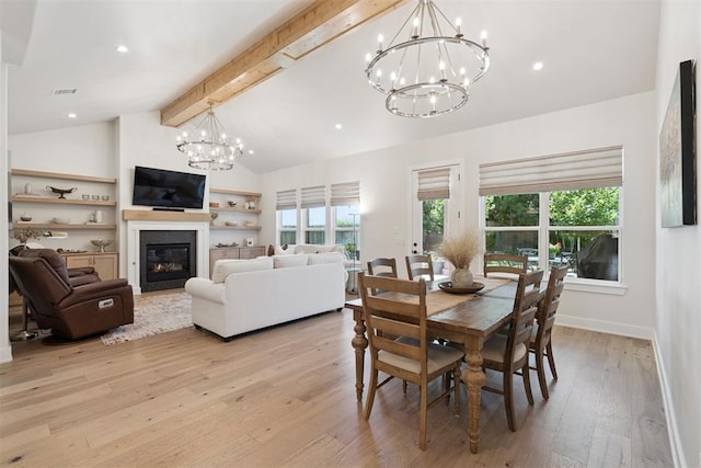 200 Pont Neuf Ct, Edmond, OK 73034 - dining room with a chandelier, light wood-type flooring, a glass covered fireplace, and recessed lighting