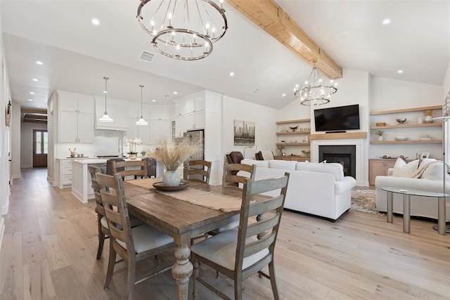 200 Pont Neuf Ct, Edmond, OK 73034 - dining room with a chandelier, light wood-style floors, recessed lighting, and a glass covered fireplace