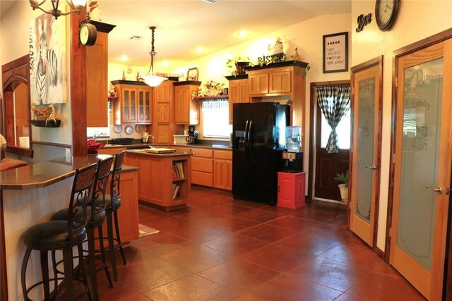 11800 Bryant Rd, Lexington, OK 73051 - kitchen featuring black fridge with ice dispenser, dark countertops, open shelves, pendant lighting, and lofted ceiling