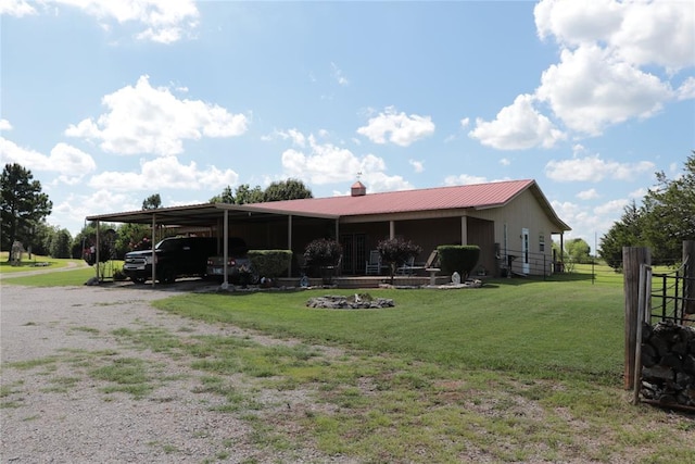 11800 Bryant Rd, Lexington, OK 73051 - view of front facade with gravel driveway, a metal roof, a detached carport, and a chimney