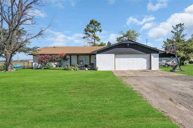 323 W 13th St, Snyder, OK 73566 - ranch-style home featuring driveway, a garage, and brick siding