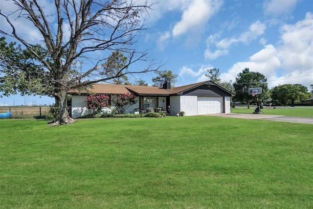 323 W 13th St, Snyder, OK 73566 - single story home featuring a garage, driveway, a front lawn, and a chimney