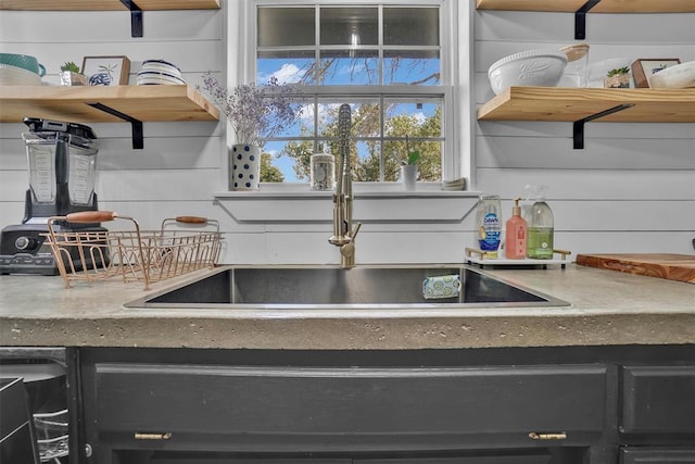 323 W 13th St, Snyder, OK 73566 - kitchen view of open shelves, wet bar, and dark cabinetry