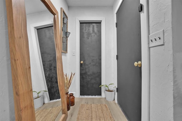 323 W 13th St, Snyder, OK 73566 - hallway featuring wood finished floors