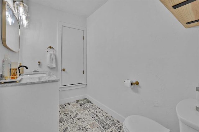 323 W 13th St, Snyder, OK 73566 - half bath featuring toilet and vanity